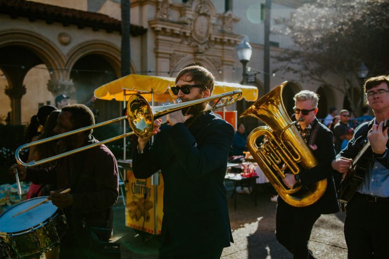 Parade of musicians. Men playing brass instruments